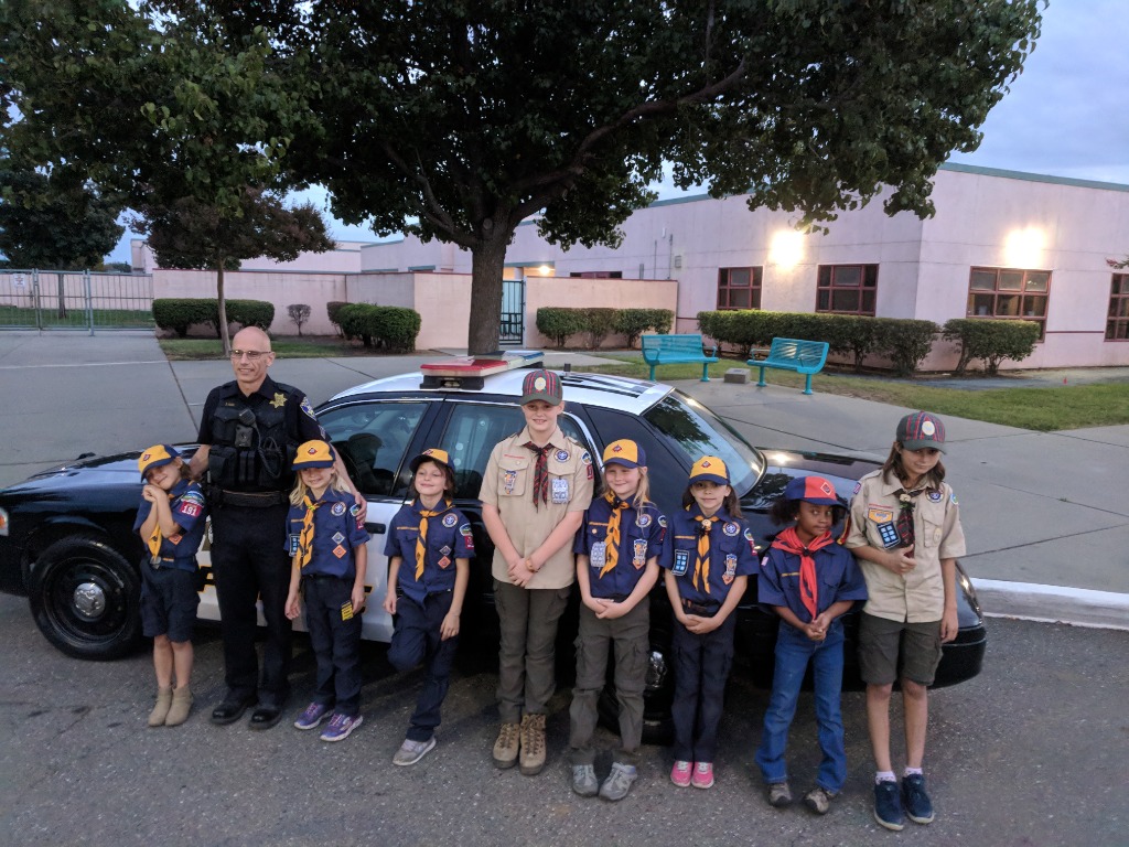 Cub Scouts visiting with local Police Officer